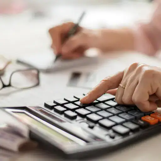 hand on calculator