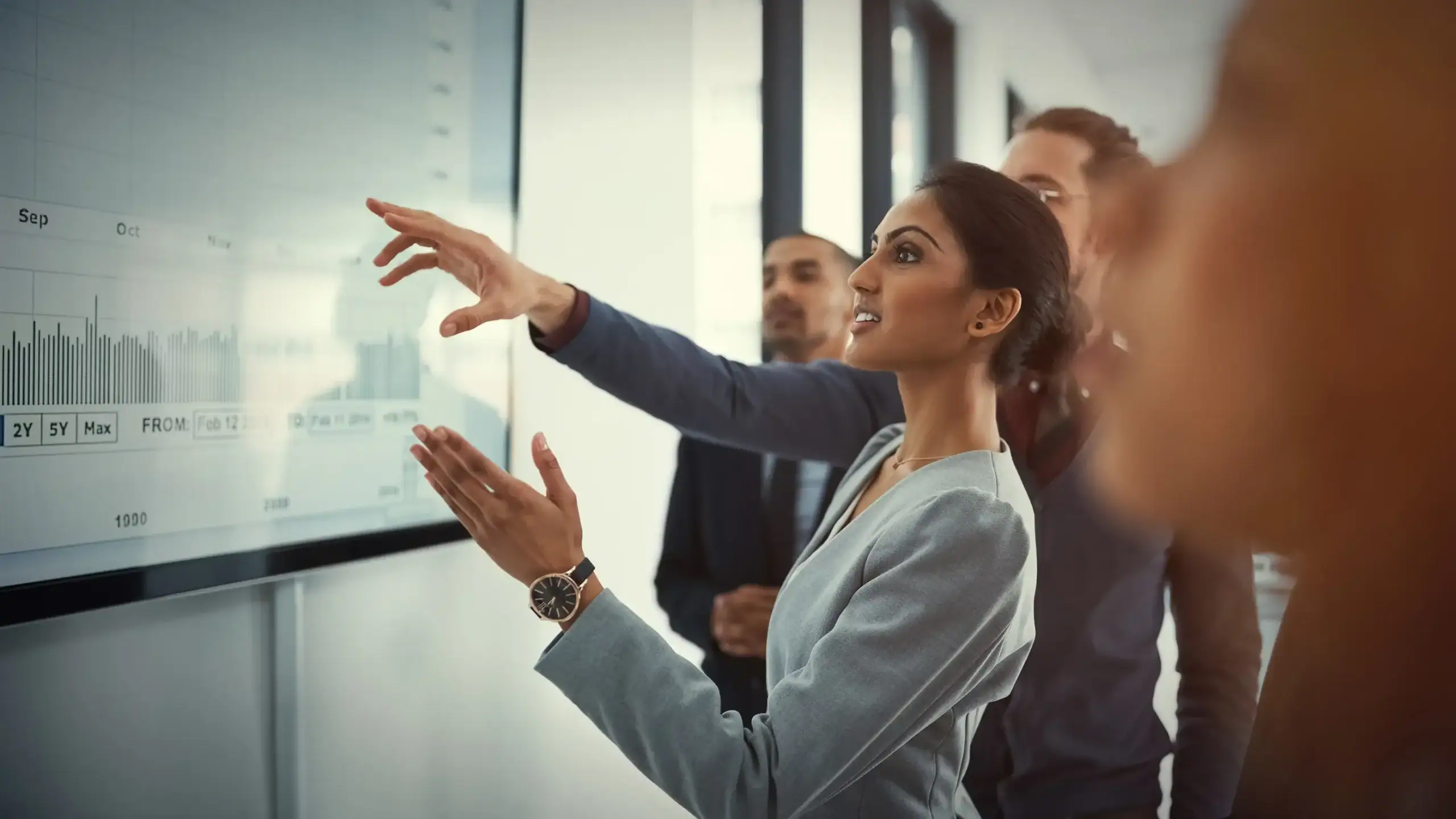 people looking over graphs