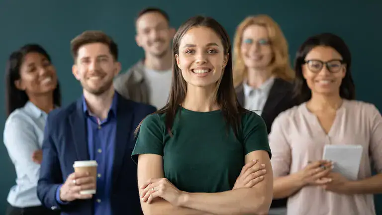 group of people standing around smiling