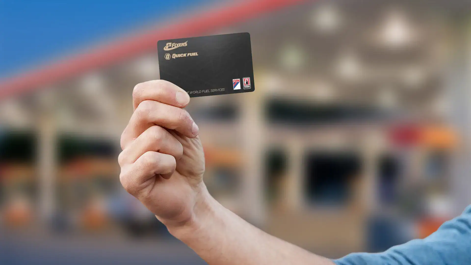 Hand holding Flyers credit card