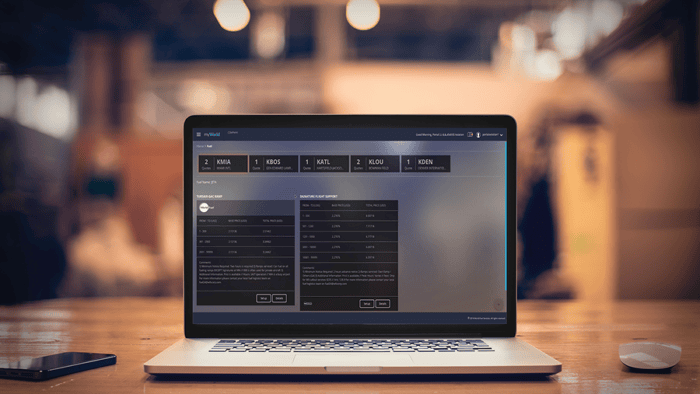 Laptop displaying data analysis interface.