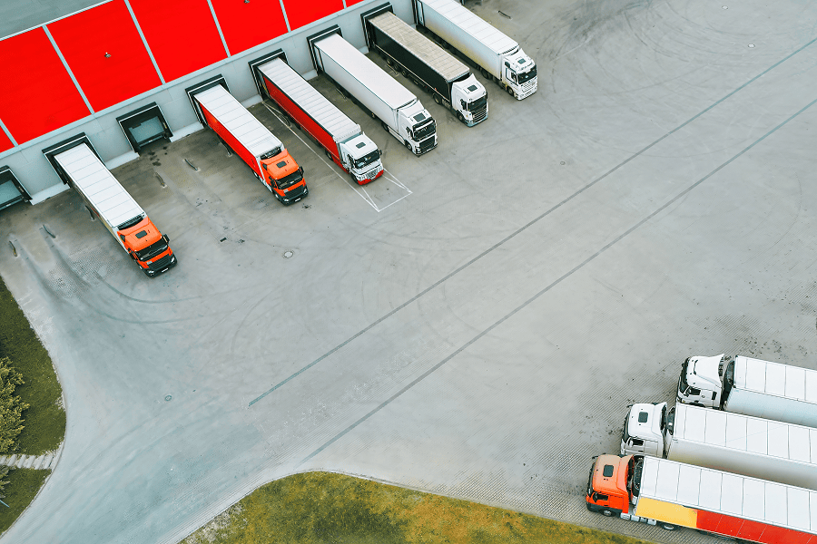 Aerial view of parked delivery trucks.