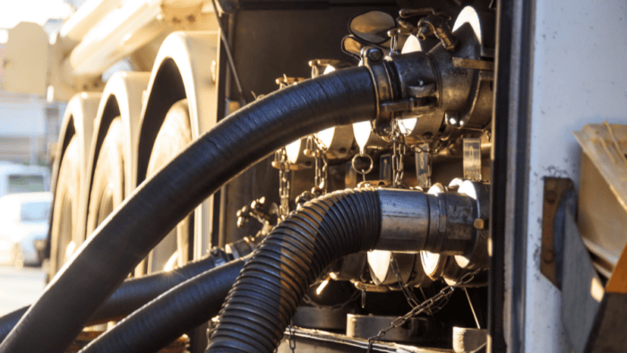 Fuel transfer hoses and connections visible.