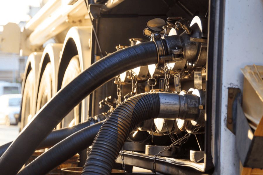 Fuel transfer hoses and connections visible.