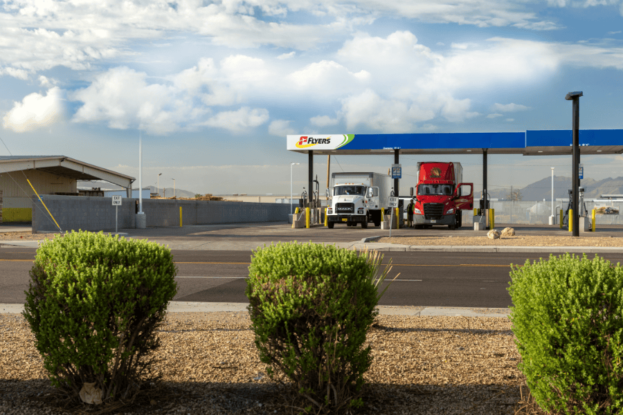 Two trucks refuelling at service station.