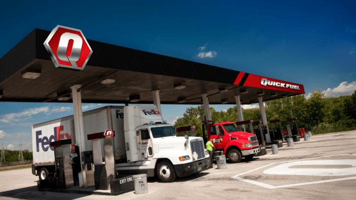 Fuel station with trucks parked.