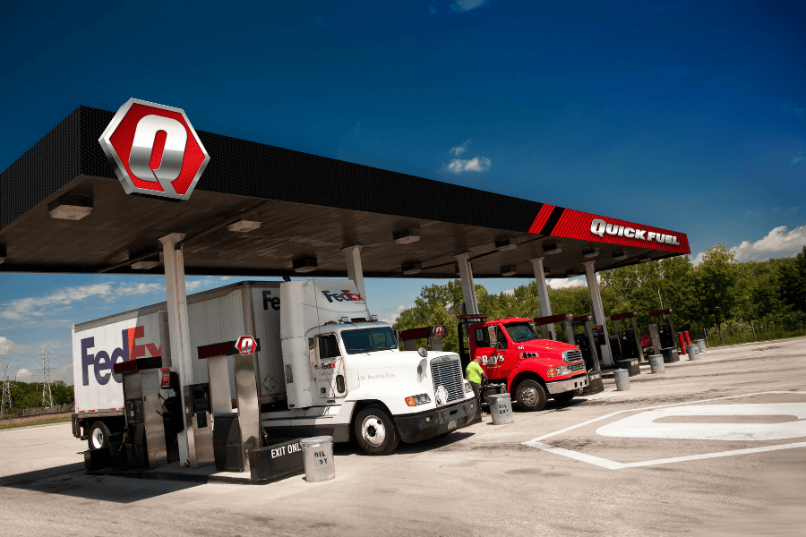 Fuel station with trucks parked.