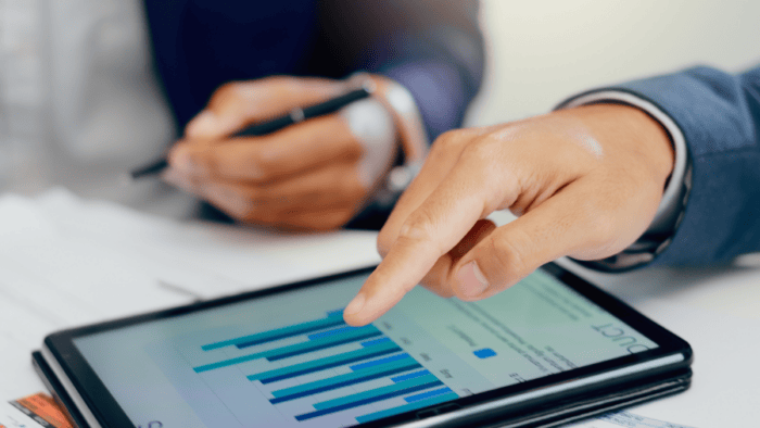 Business professionals analysing performance data.