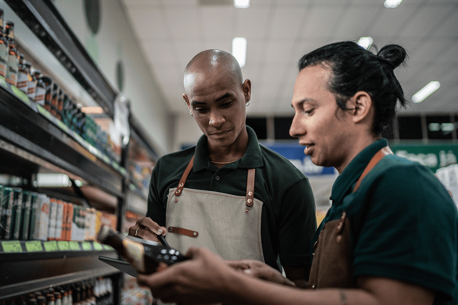 Two men discussing products in store.