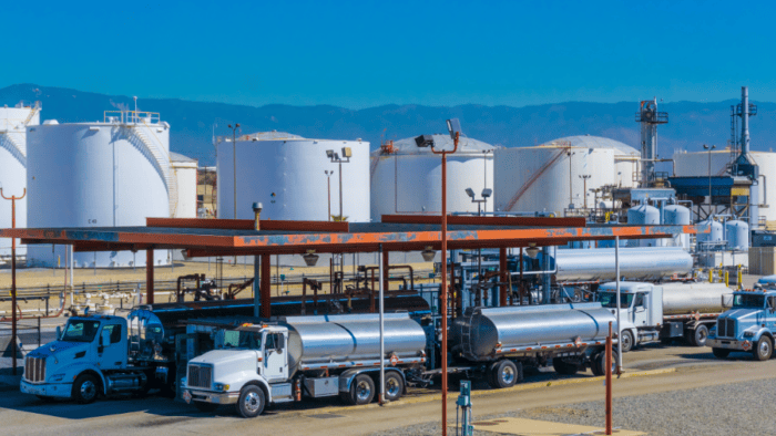 Fuel trucks at a terminal loading area.