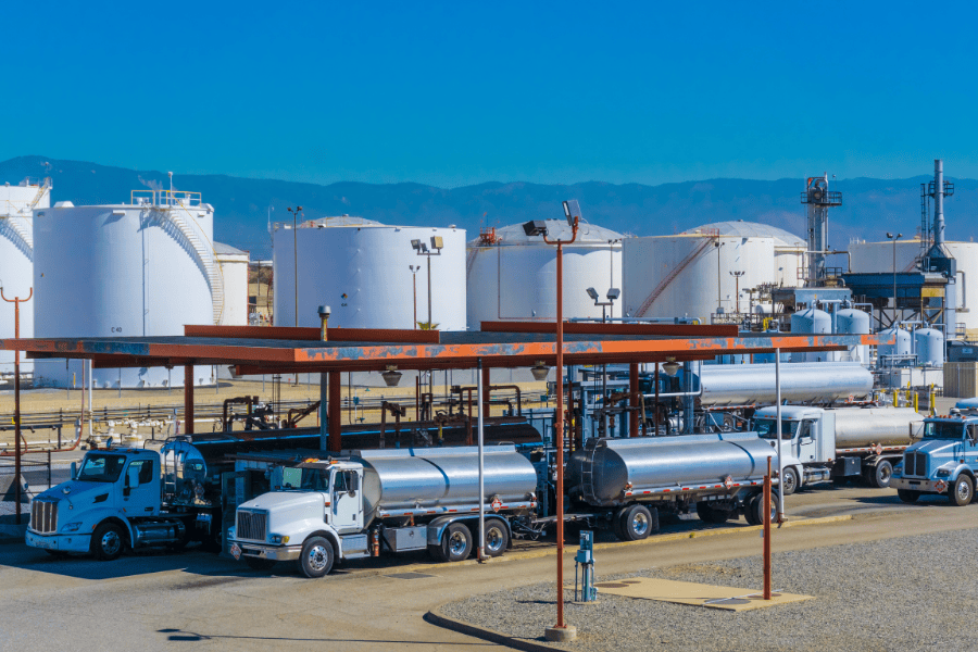 Fuel trucks at a terminal loading area.