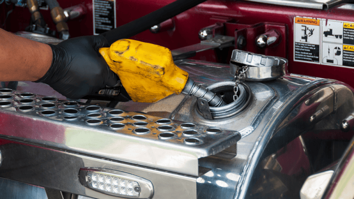 hand fueling a truck