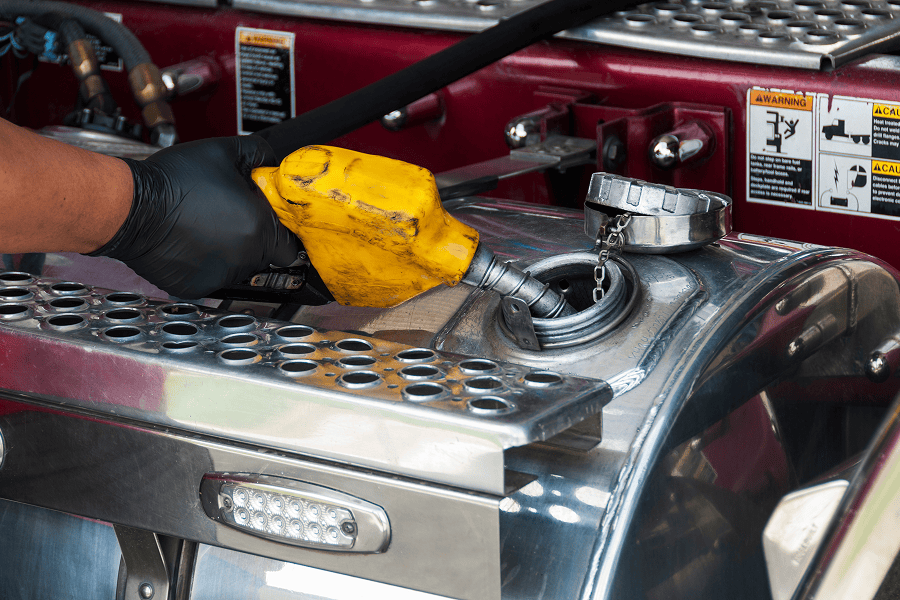 hand fueling a truck