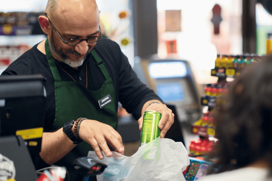 Man putting items in bag