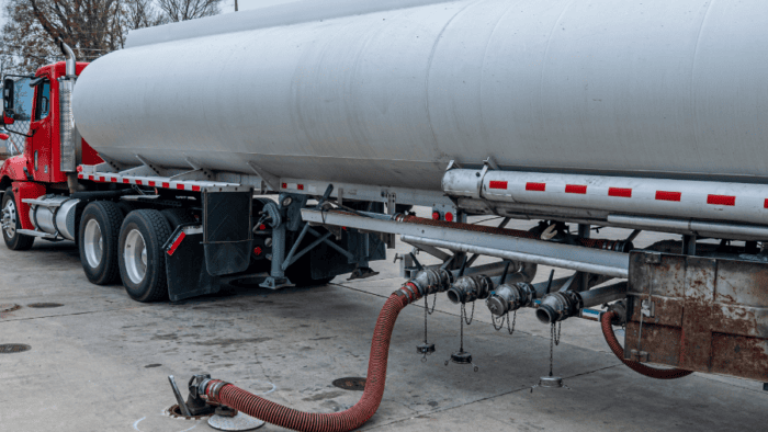 Commercial tanker fueling a gas station