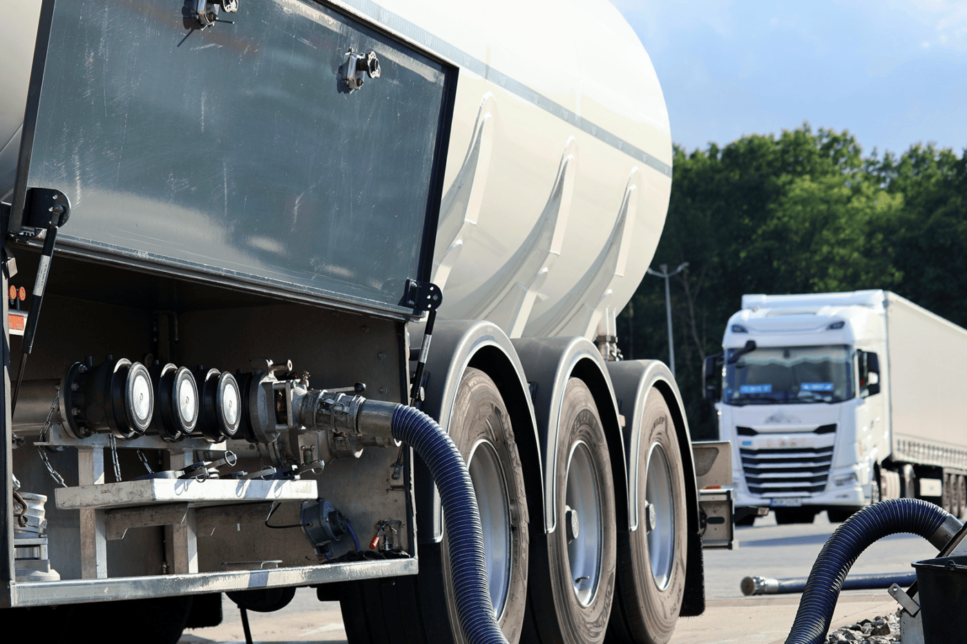 Tanker truck refueling at station