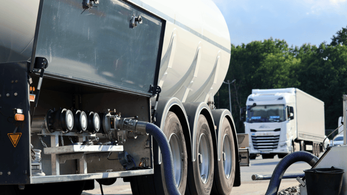Tanker truck refueling at station