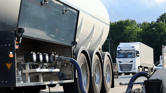 Tanker fueling a gas station