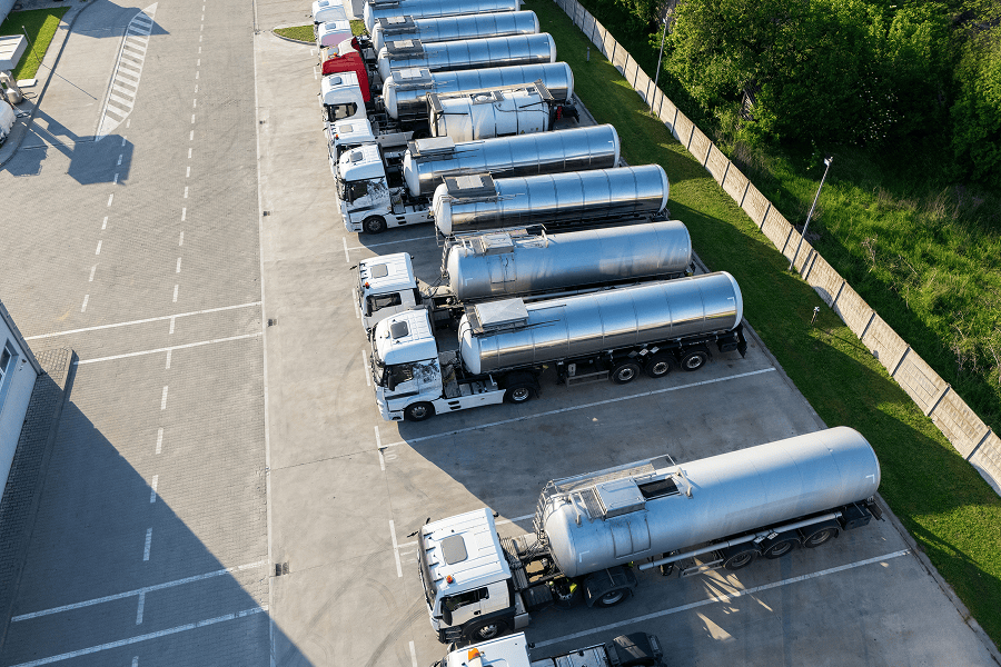 Aerial view of parked tanker trucks.