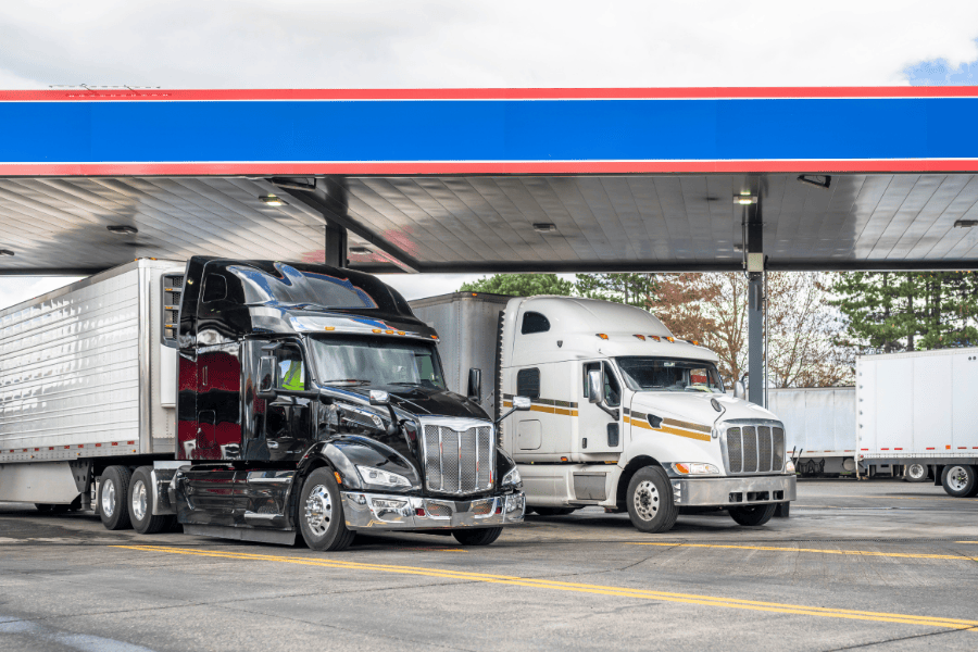 trucks at a fueling station