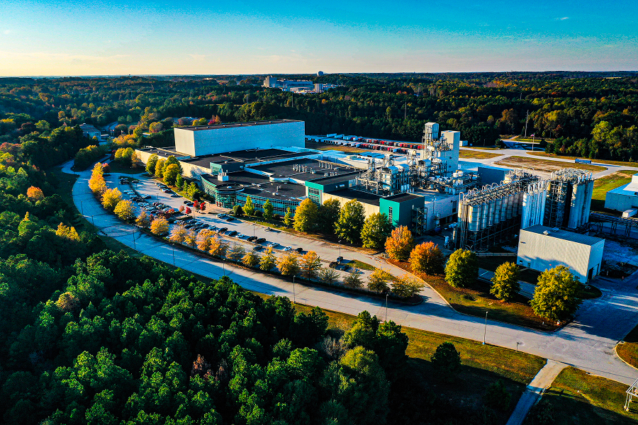 Industrial complex in Atlanta surrounded by autumn trees.