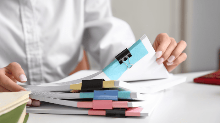 woman looking over documents