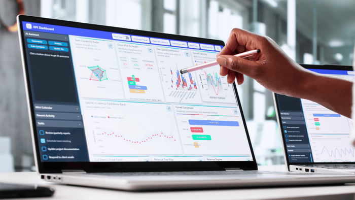Person analysing data on laptop screen.