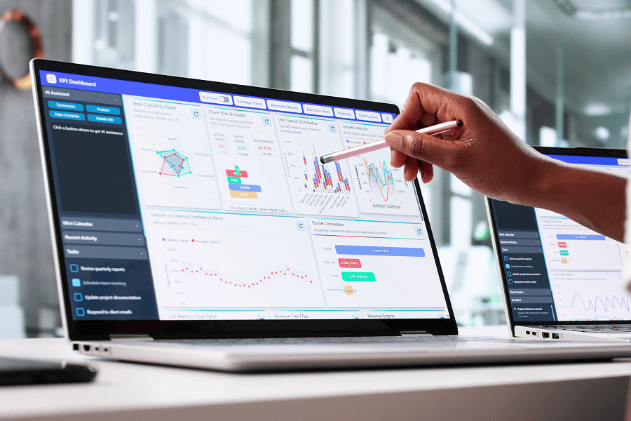 Person analysing data on laptop screen.