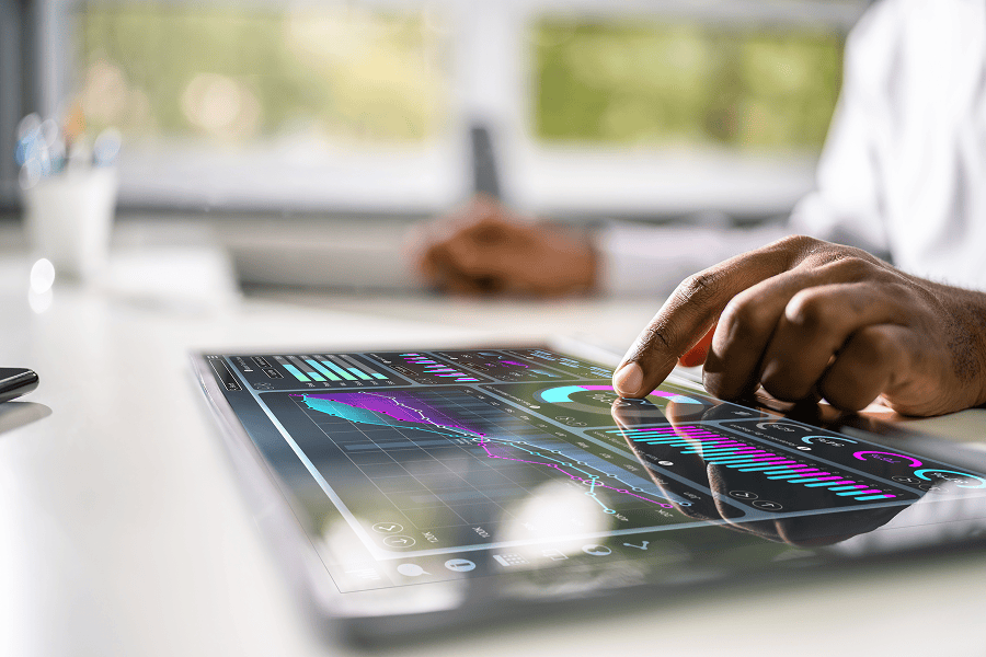 Businessman analysing data on tablet