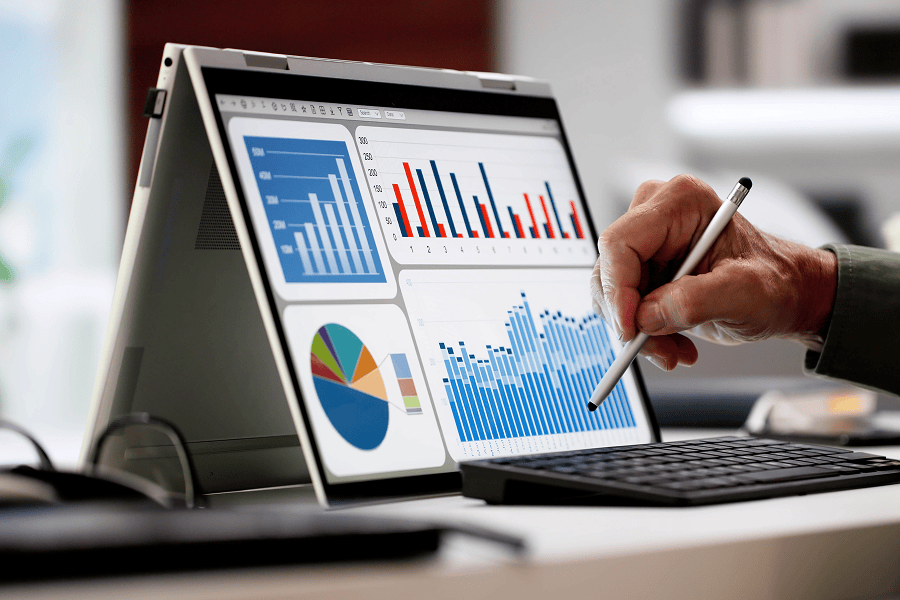Analyst reviewing data on laptop screen.