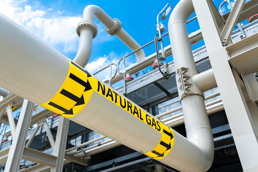 Natural gas pipeline with warning signage.