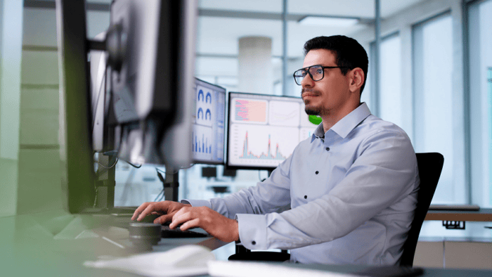 man looking at screen monitor