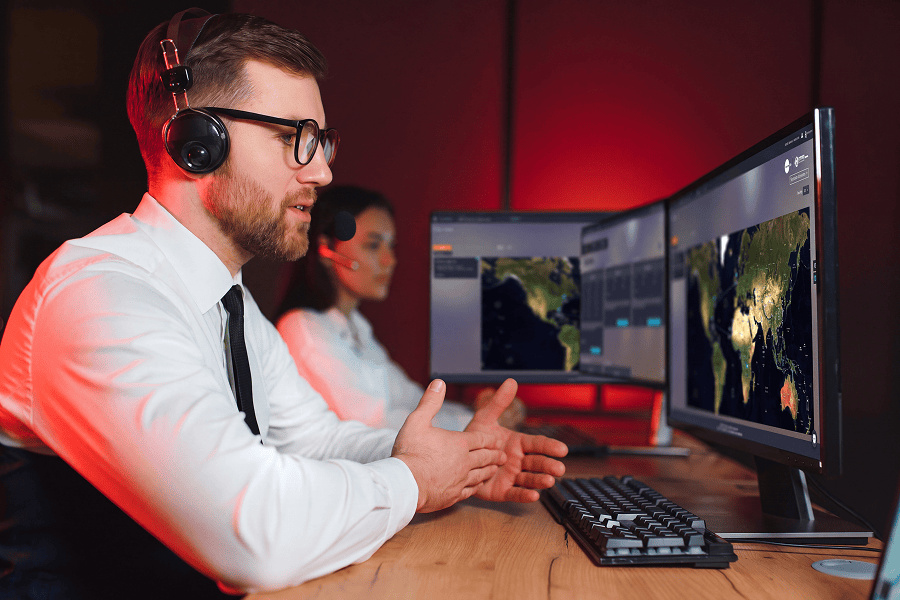 Two professionals working at computers.