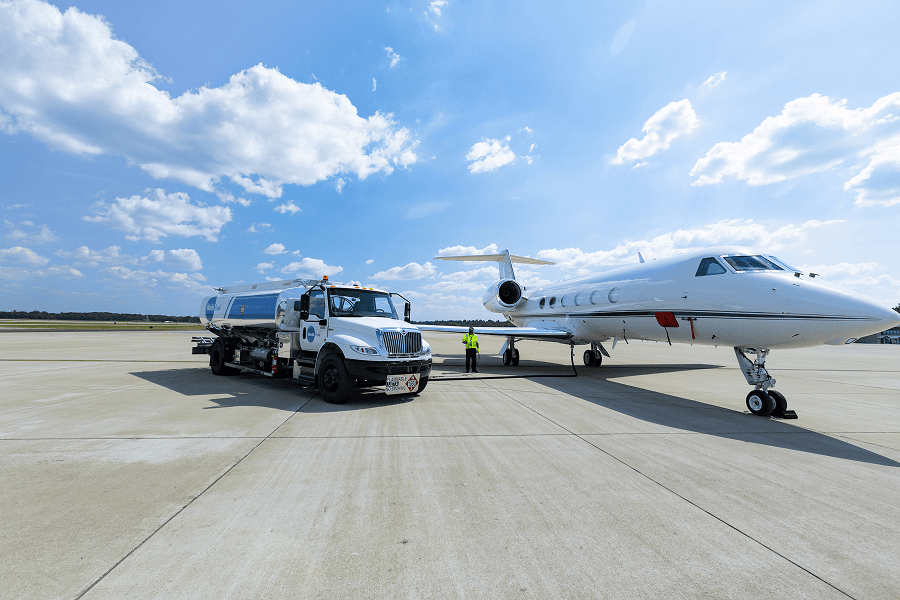 Jet being refuelled by service truck.