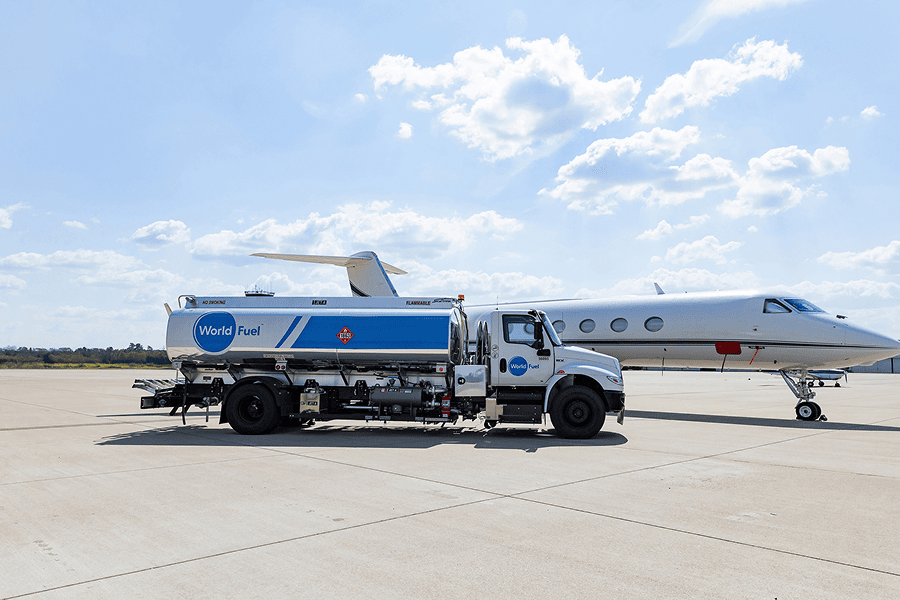 Fuel truck next to private jet.