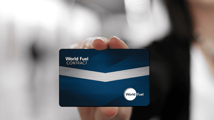 Person holding a World Fuel contract card.