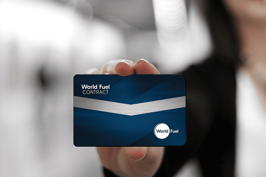 Person holding a World Fuel contract card.