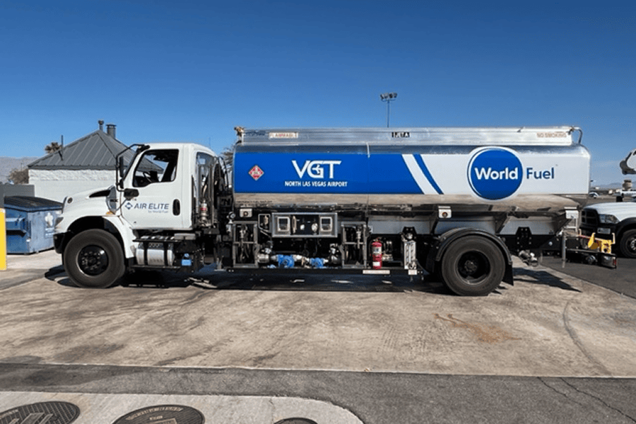 A clean side view of an Air Elite branded aviation fuel truck parked on an airfield tarmac.