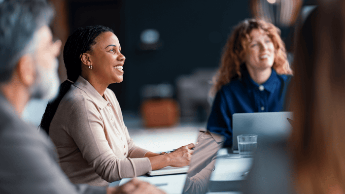 A business meeting with diverse professionals collaborating inside an office