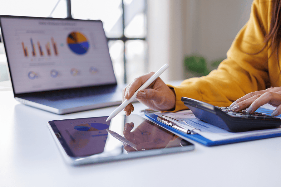 Businesswoman analysing data with technology
