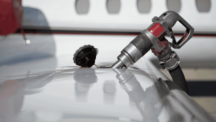 Jet fuel pump near aircraft surface.