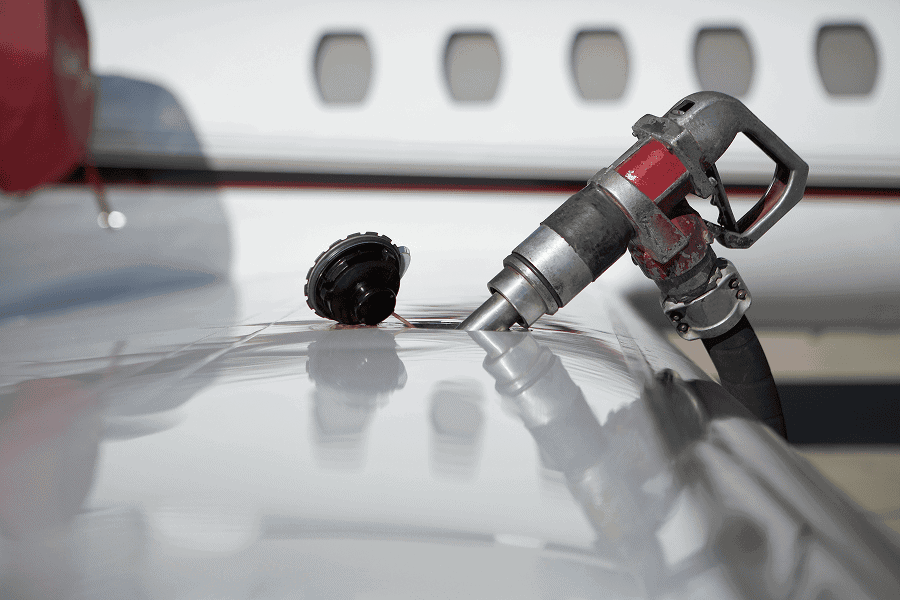Jet fuel pump near aircraft surface.