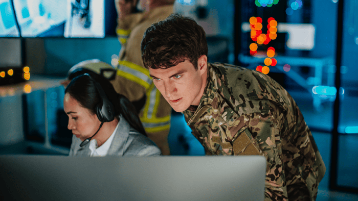 A crisis management team working inside an emergency operations center
