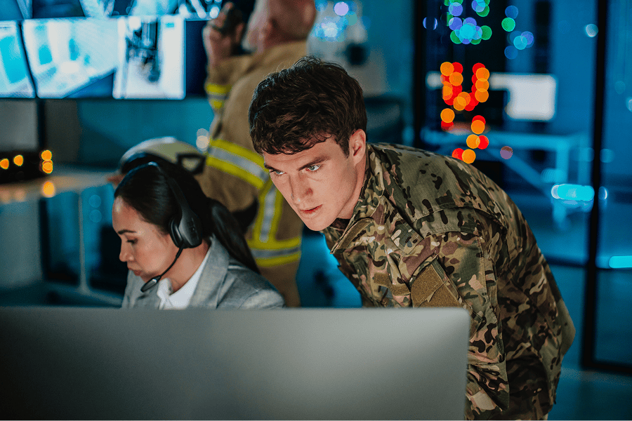 A crisis management team working inside an emergency operations center