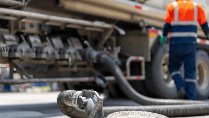 man refueling truck