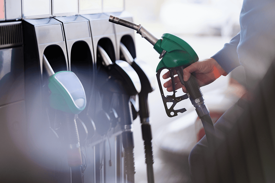 hand holding fuel dispenser nozzle
