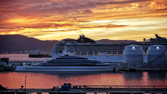 Cruise ships at sunset by harbour.