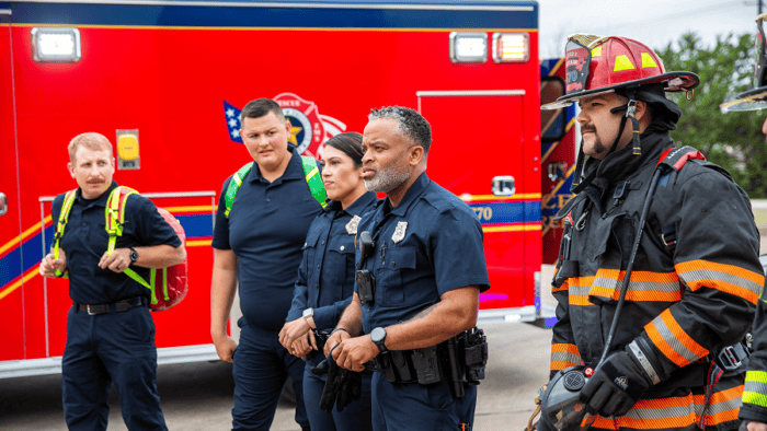 Emergency responders in front of ambulance