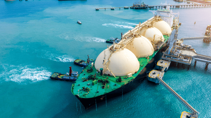 A commercial fuel tanker vessel docked securely at a port terminal pier during fuel logistics operations