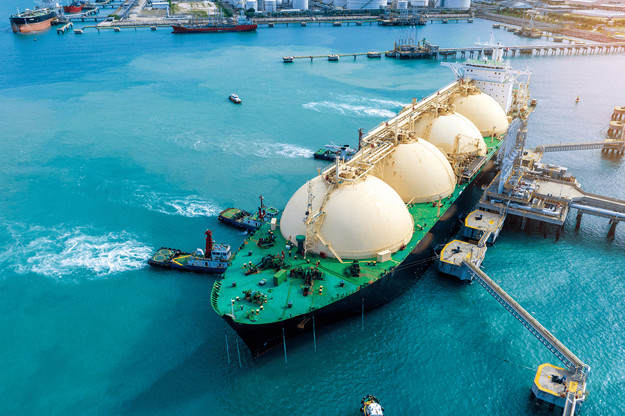 A commercial fuel tanker vessel docked securely at a port terminal pier during fuel logistics operations